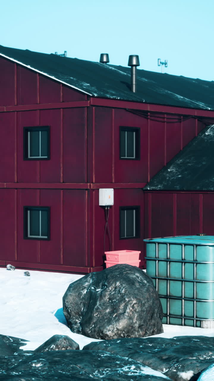 A red building in a snowy landscape