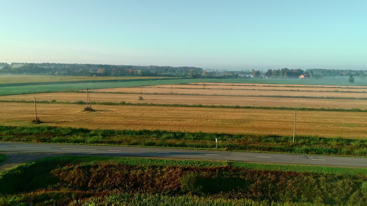 Aerial shot of fields on a farm on a sunny day