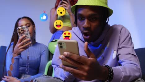 shocked group of gen z friends looking at mobile phone with motion graphics emojis showing multiple social media notifications liking and reacting to online content