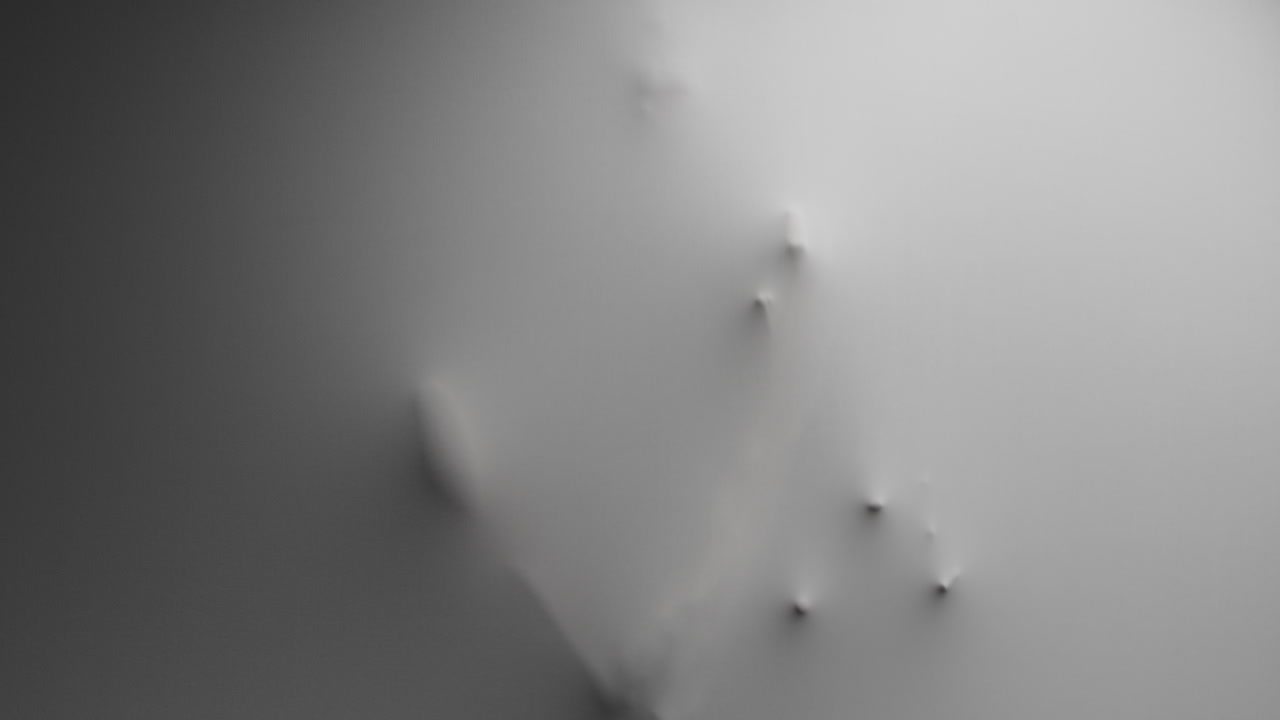 A scary silhouette of a man appears from the white wall