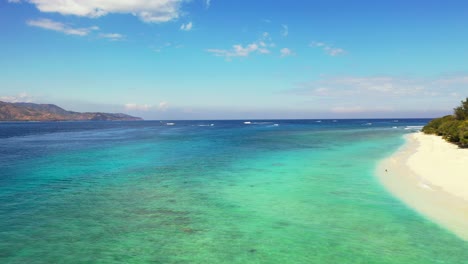 Sailboats-near-tropical-island-white-sand-beach.-Indonesia