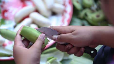 peeling banana
peeling raw banana with knife