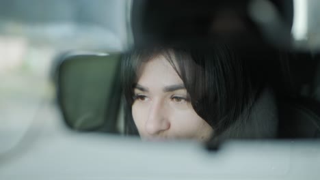 confident businesswoman driving her car, dressed in elegant business attire, showcasing independence and professionalism in a modern vehicle interior