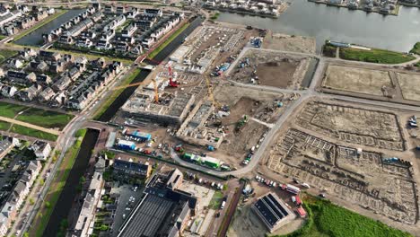 Drone-view-of-new-Dutch-housing-development-project-in-Weesp-around-water-canals