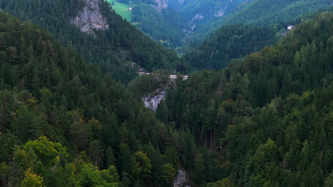 Aerial view of Semmering forest and mountains in Austria with a bridge
