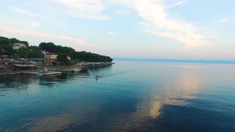 aerial view of the bay with a passing boat in selca island brac croatia europe