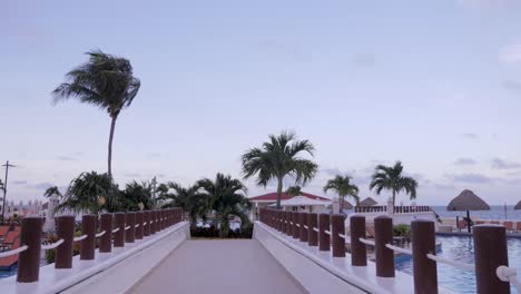 a bridge over a pool at a mexican resort