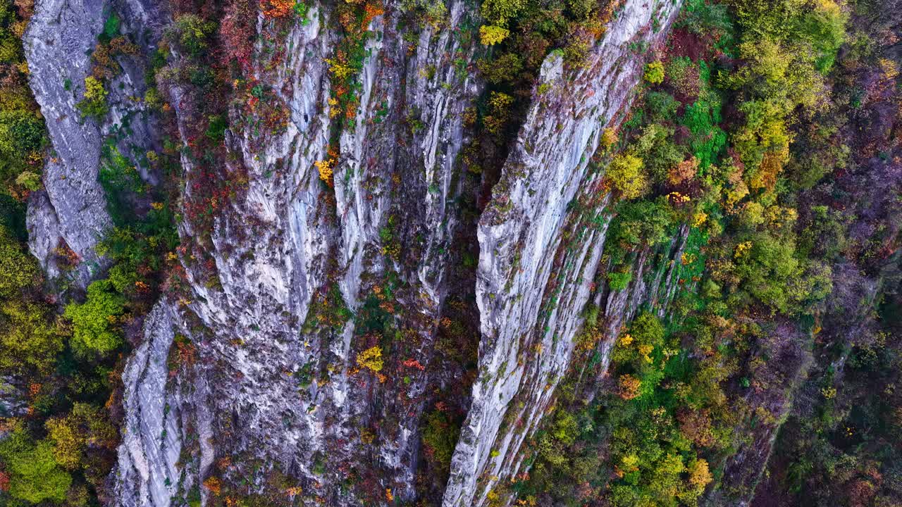 Aerial view of colorful autumn cliffs in Italy near Lago d'Iseo