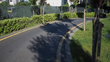 city park bike path with tree shadows