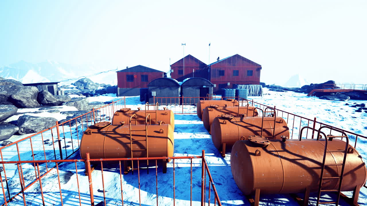 Remote research facility surrounded by snow covered mountains in a remote area