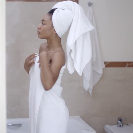 woman with towel on head in the bathroom