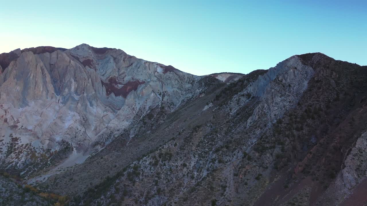 Convict Lake Canyon trail Sierra Nevada Range rugged mountainside layers Mammoth Lakes aerial drone California autumn fall late afternoon shaded rugged valley peaks clear skies upwards motion