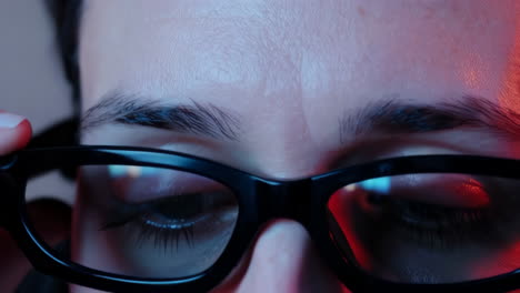 woman wearing glasses in vivid lighting