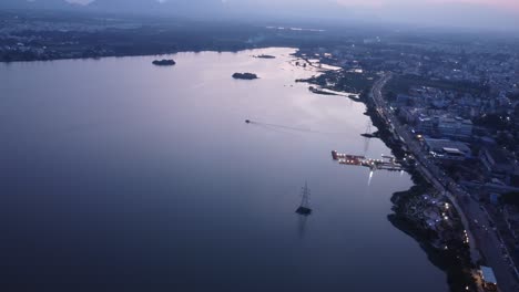 sunset view of kovai lake, coimbatore city under hazy sky due to air pollution, tamil nadu, india