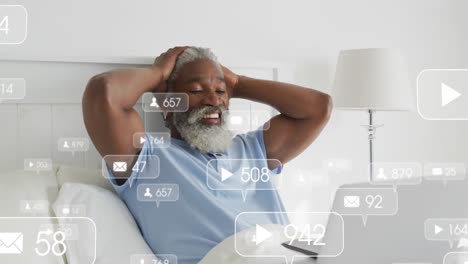 animation of social media data processing over african american man using laptop