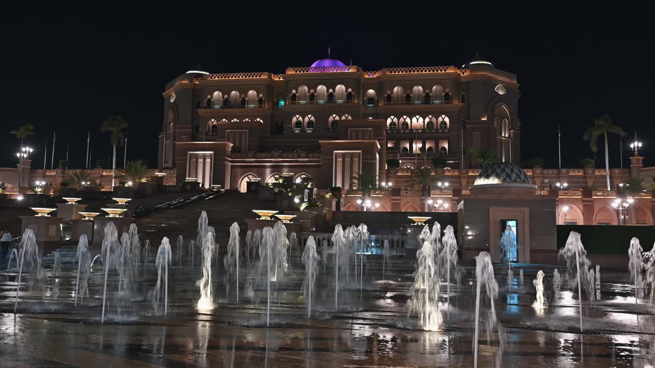 Nighttime glow of Abu Dhabi's iconic Emirates Palace Hotel in the UAE