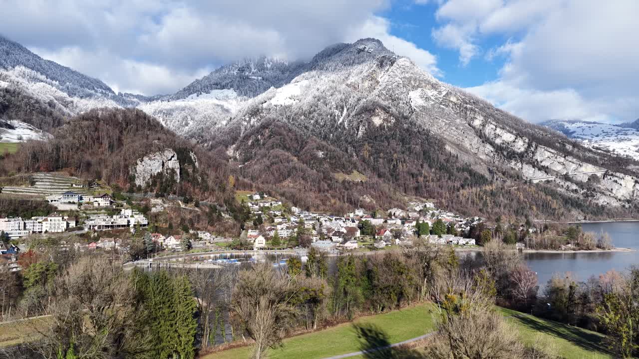Aerial view of Walensee showing snowy mountains, lakeside villages and winter scenery