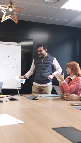 businesspeople applauding after a successful presentation in conference room