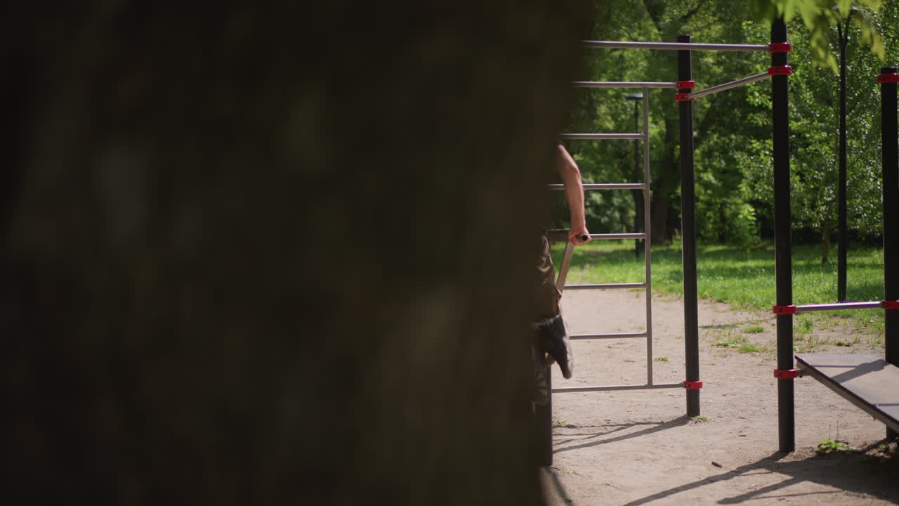 Individual Performing Controlled Dips At Park, Person Demonstrating Strong Form On Parallel Bar Dips Outdoors, Athlete Executing Precise And Controlled Dips At Calisthenics Park Area