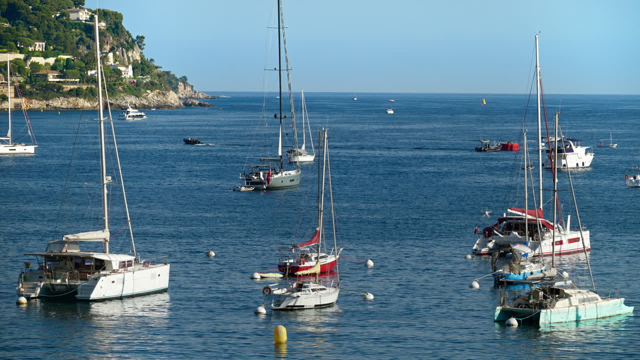 Colourful boats docked in the harbour in Villefranche-sur-Mer, France
