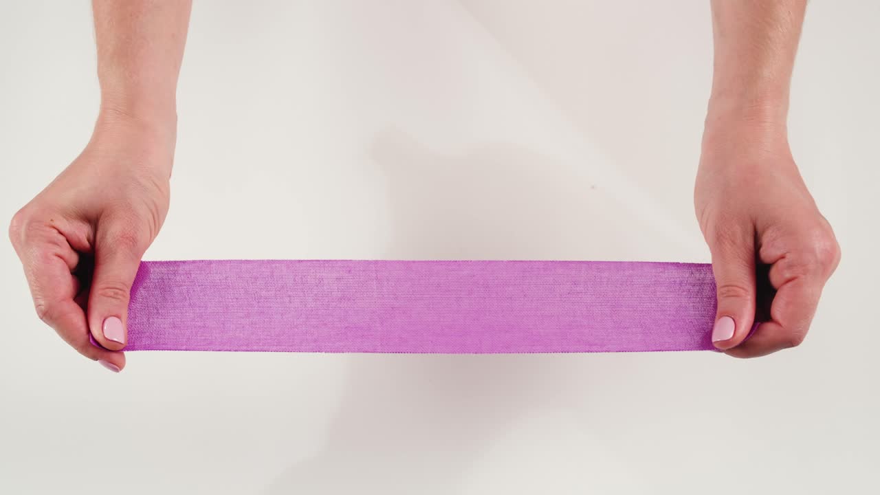 Kinesiology medical taping, doctor Physical therapist applying elastic surgical tape to patient body, treating injured knee young athlete.Post traumatic rehabilitation, sport physical therapy recovery