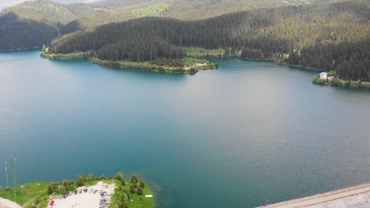 Aerial drone shot of Bolboci Lake at daylight. Bucegi Mountains, Romania
