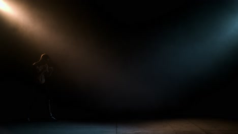 man boxing silhouette in a dark studio