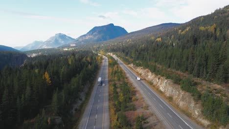 Peaceful-Scene-of-Cars-driving-on-the-Coquihalla-Highway-5-in-British-Columbia,-Canada-on-a-sunny-day-in-fall