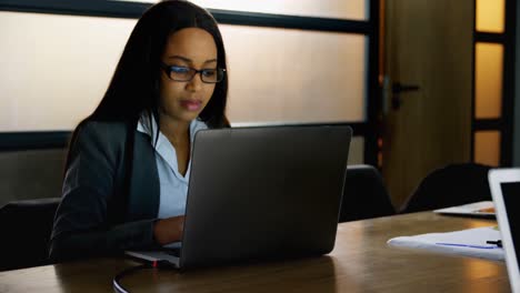 businesswoman using laptop in office 4k