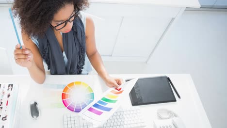 animation of female fashion designer working in fashion studio