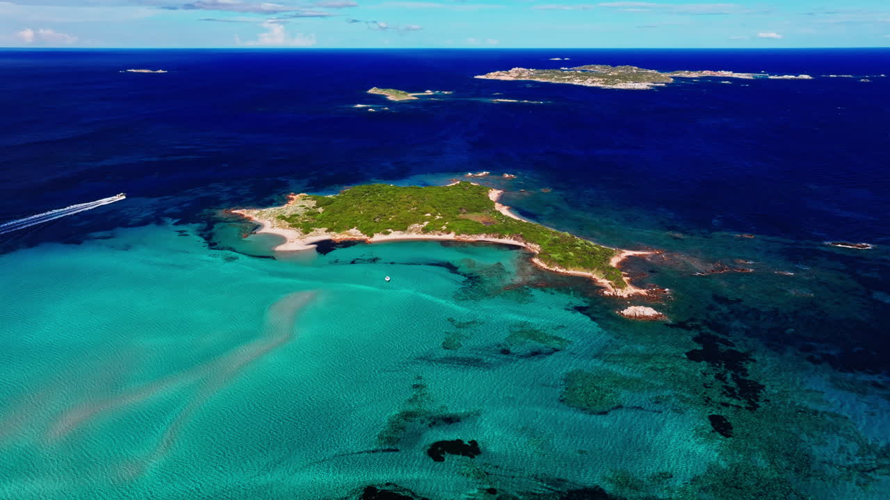 Aerial drone view of beautiful coastline of Corsica, France. High view of the colorful turquoise sea and the picturesque green landscape. Bird's eye view of the beaches. Summer holidays destination