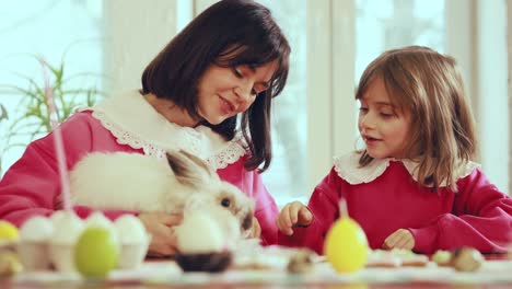 Mother and Daughter Celebrating Easter with a Bunny