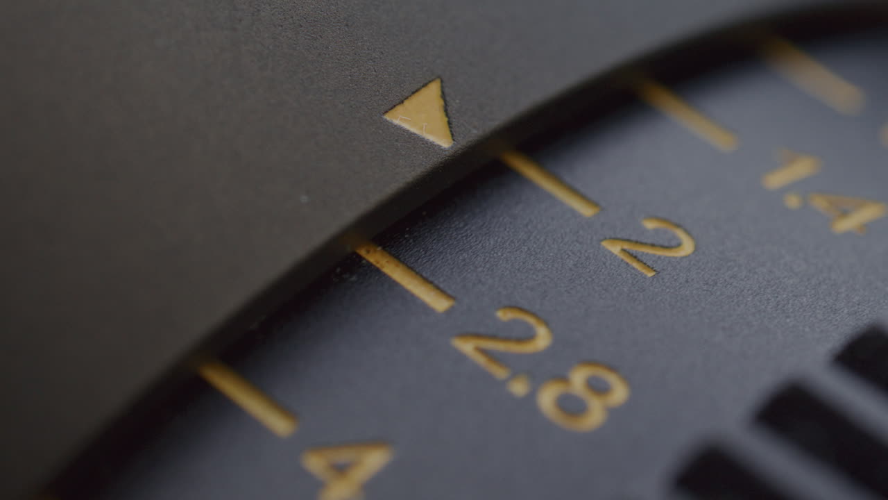 Close-Up of Camera Aperture Ring Turning and Stopping at 1.4 Number