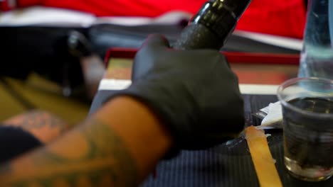 close-up of tattoo supplies on a tattoo artist's table