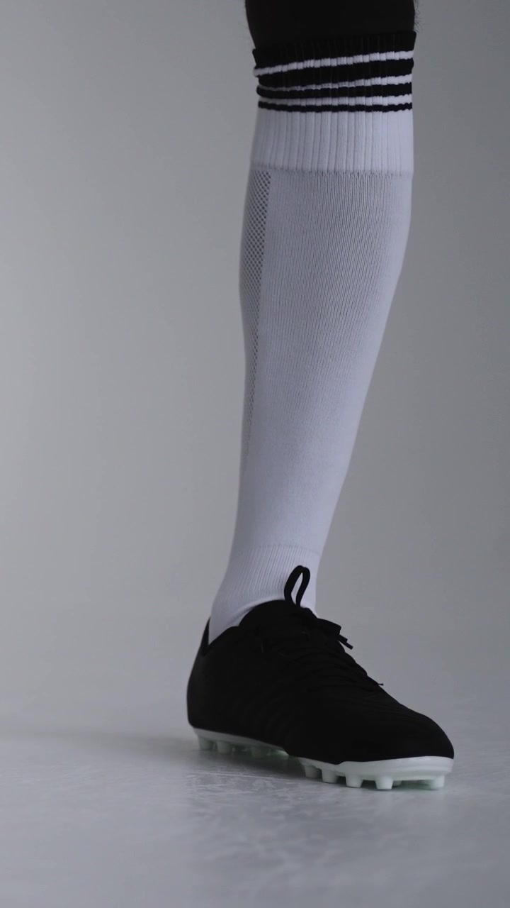 Soccer Player's Foot Rests on Ball and Lifts Off