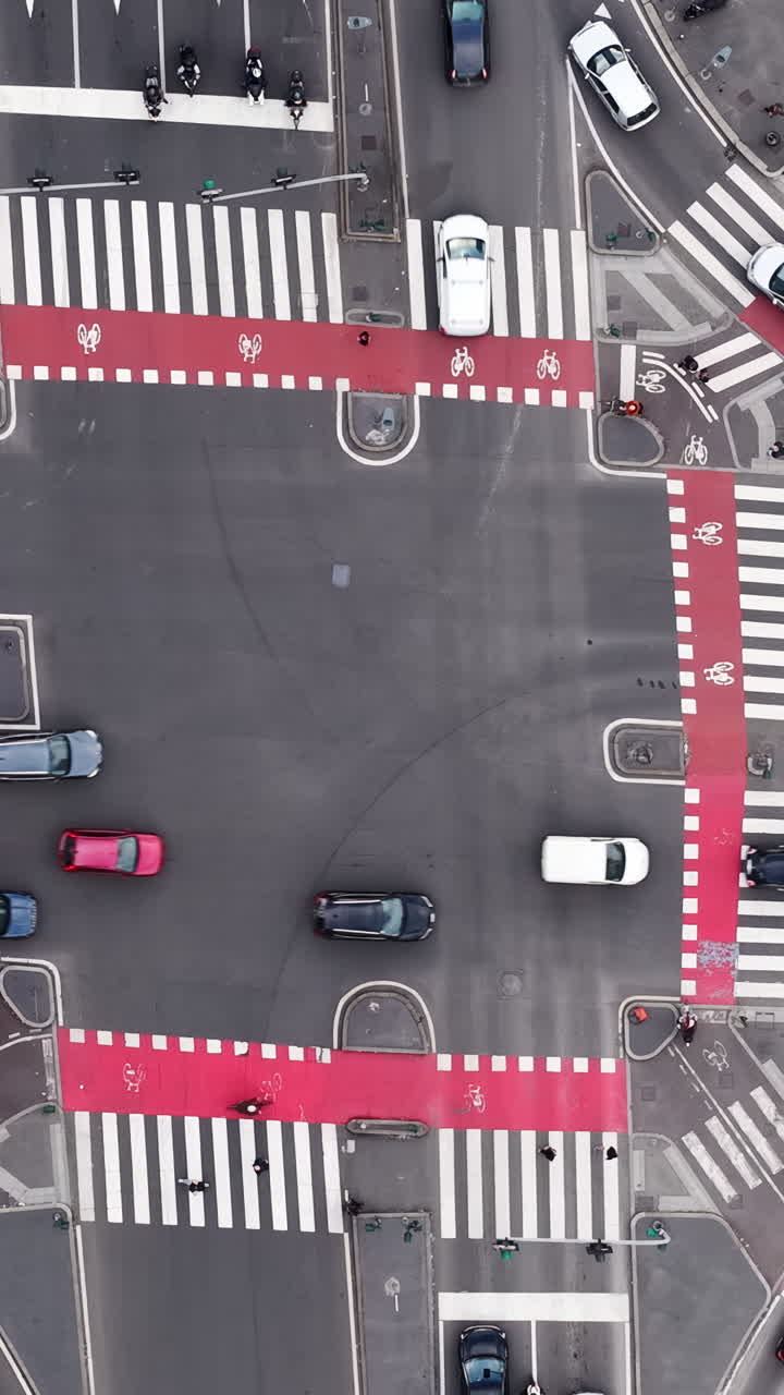 Aerial drone view of cars moving in traffic in Milan, Italy in daylight. Vertical