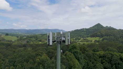 drone captures cell tower in lush landscape