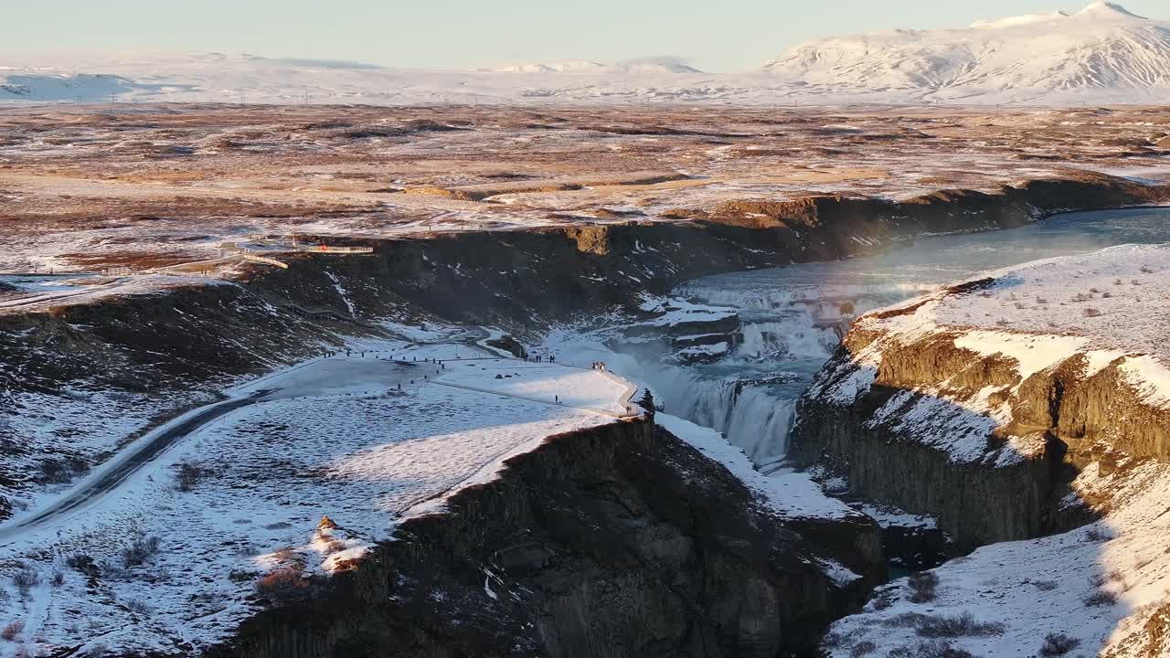 Close-up aerial view of the magnificent Gullfoss waterfall on the Hvítá River in Suðurland, Iceland, highlighting powerful cascades over rocky cliffs.