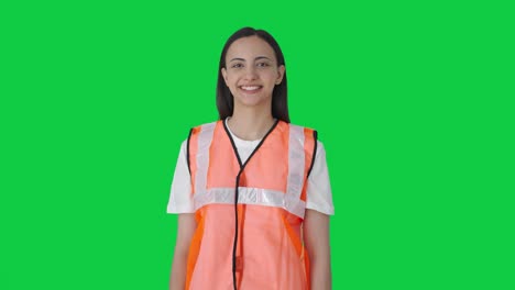 Happy-Indian-airport-ground-staff-girl-worker-smiling-Green-screen