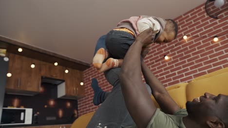 African-american-father-son-togetherness-relationship-concept,-low-angle