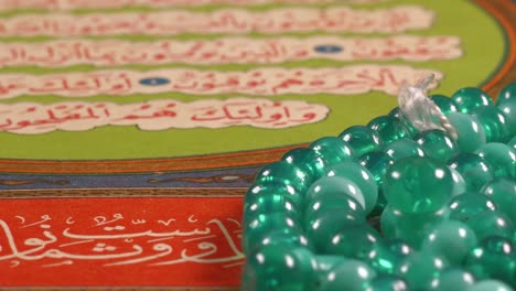 prayer beads on the quran page