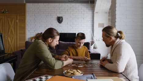 Caucasian-men-and-boy-in-the-living-room