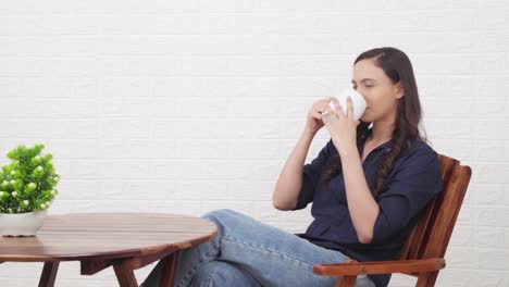 indian girl enjoying coffee at a cafe bar