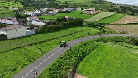 Small-Tractor-Driving-On-The-Road-Near-Rural-Village-In-Sao-Miguel,-Azores-Island,-Portugal