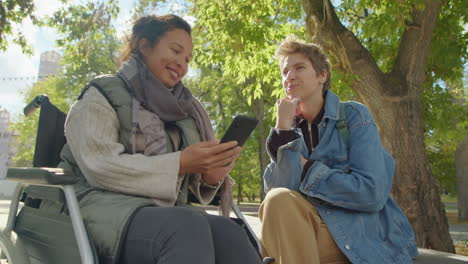 two women chatting in the park