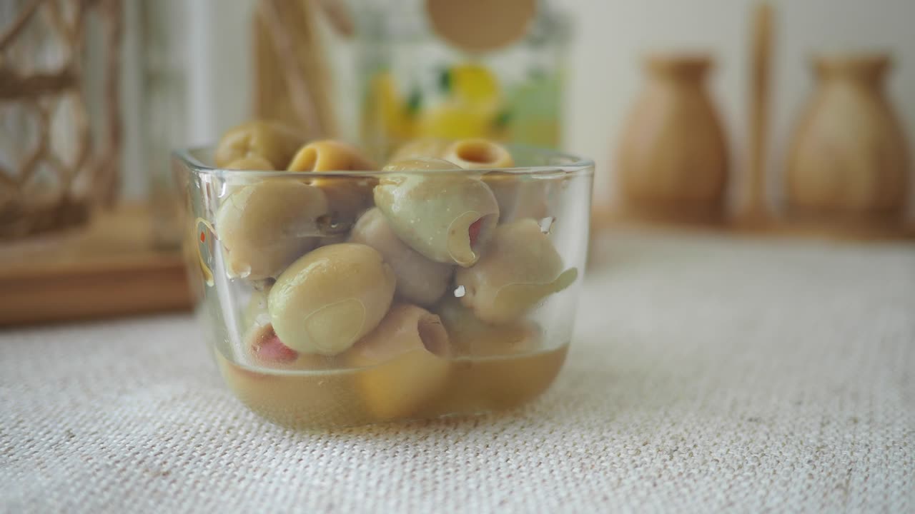 Stuffed Olives in a Glass Container