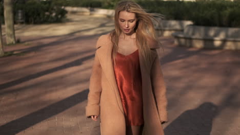 young woman walking outdoors.