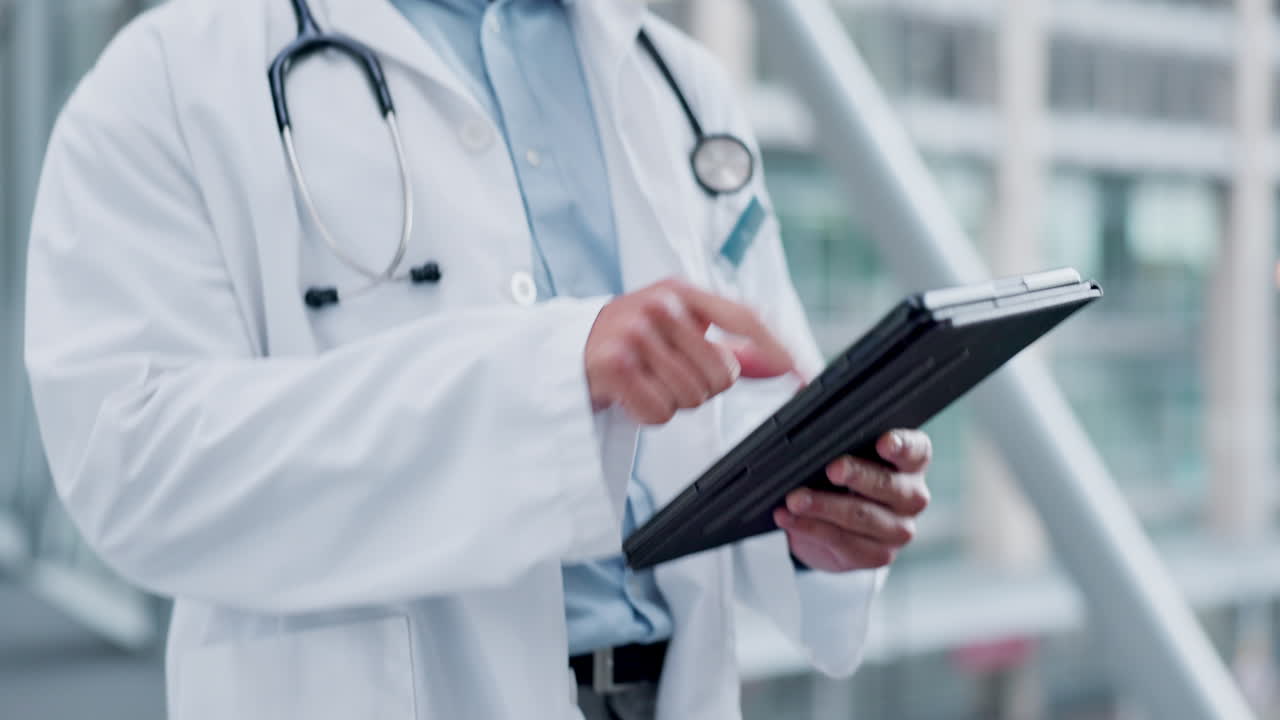 Doctor, tablet and walking in hospital for health