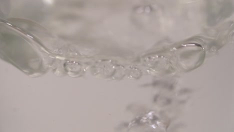 slow motion footage of water splashes in bottle