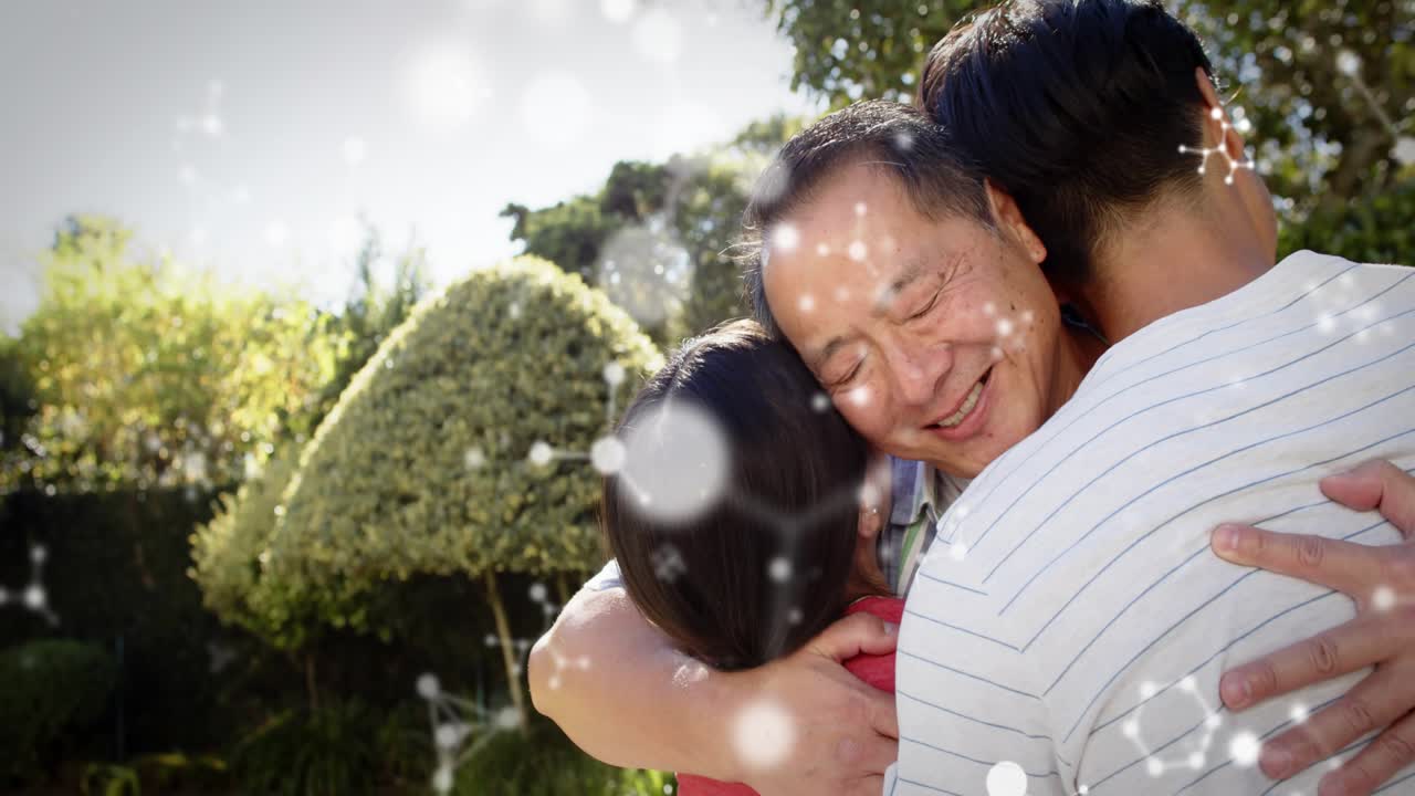 Mature man speaking while two adults placing hands and hugging in garden, sparkles boosting health